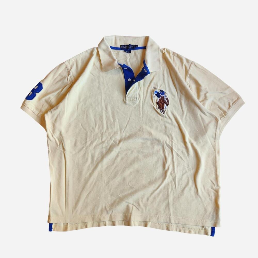 U.S. Polo Assn. cream/yellow polo shirt with blue accents and big pony embroider